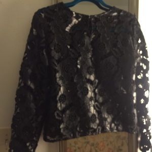 Floral cut out Faux Leather blouse. By Bisou Bisou