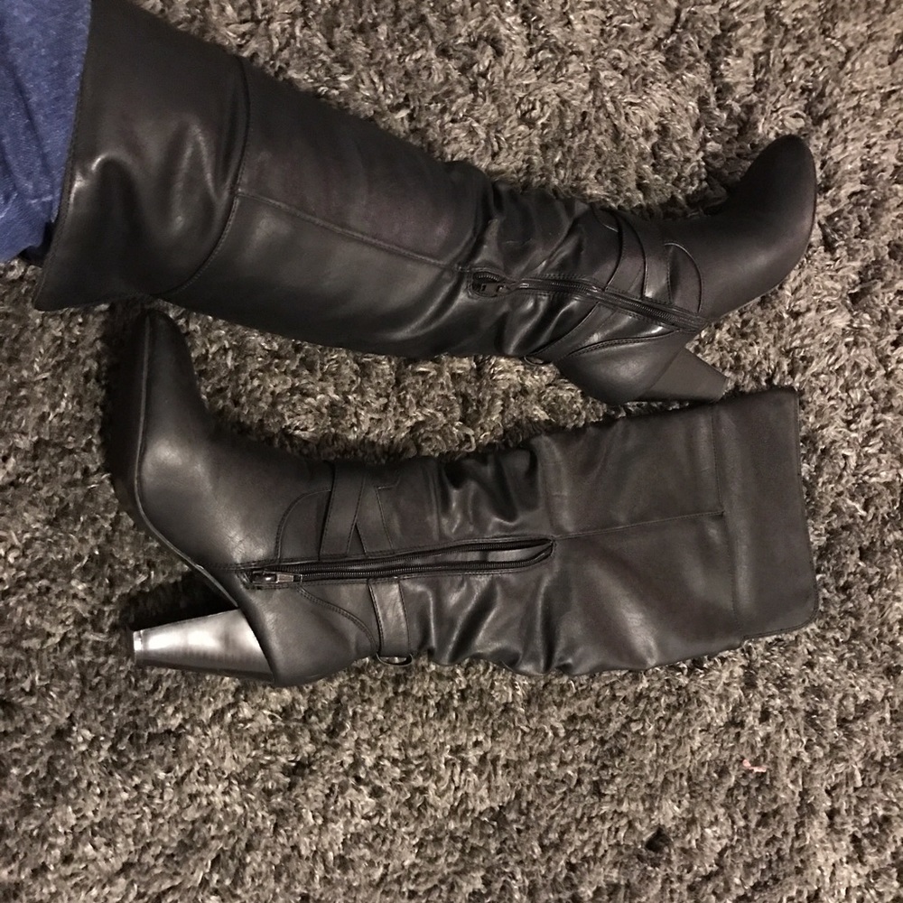 Black leather high heal boots