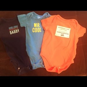 Three baby boy size 6-9 month onesies.