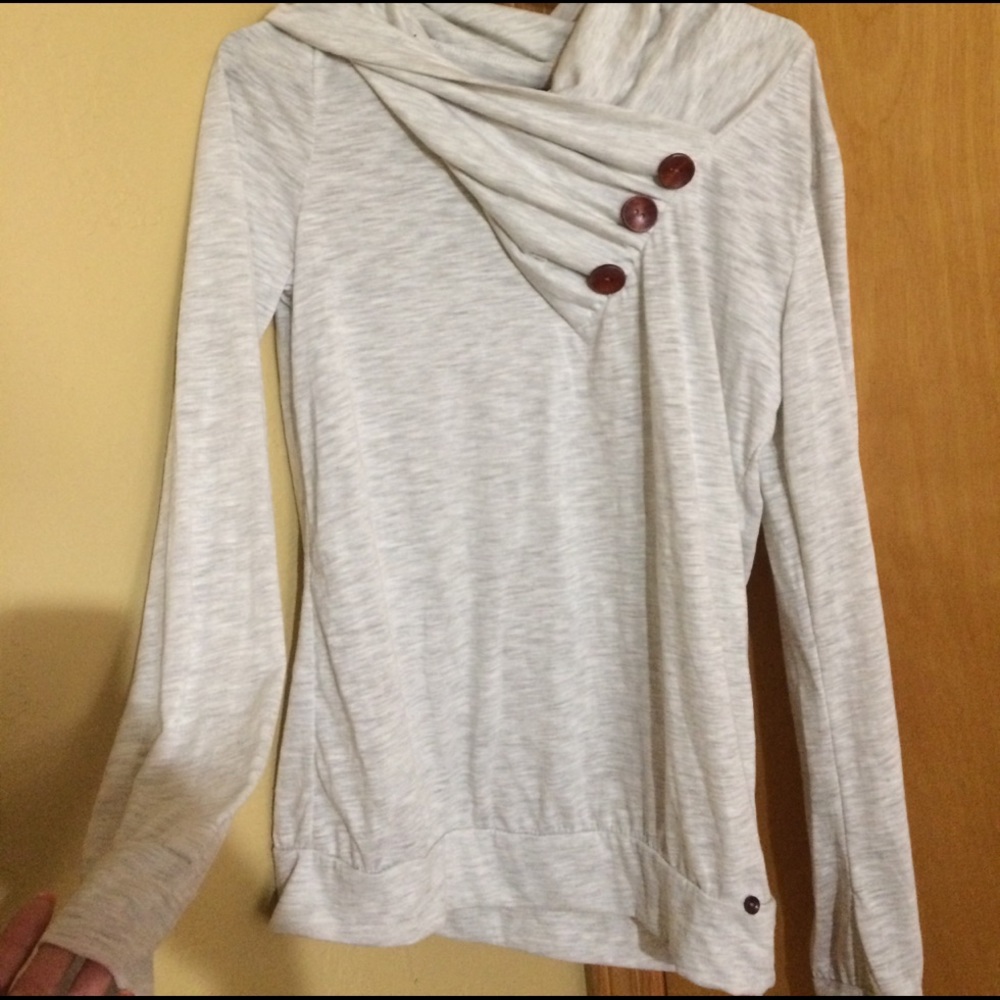 White long sleeve shirt with buttons on neck: