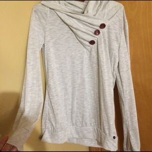 White long sleeve shirt with buttons on neck: