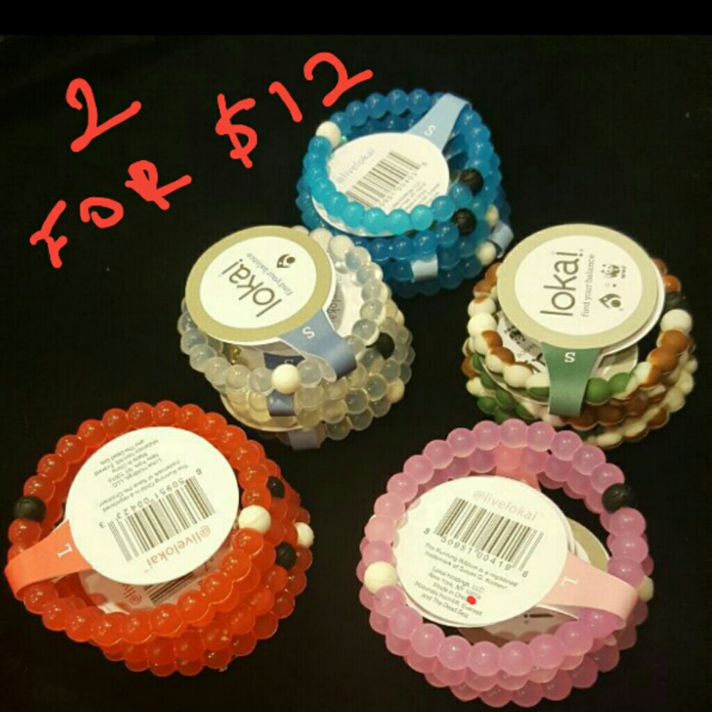 Two Lokai Bracelets.  1 large pink,  1 large  camo