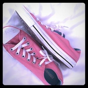 Pink Coverse lace-up low tops