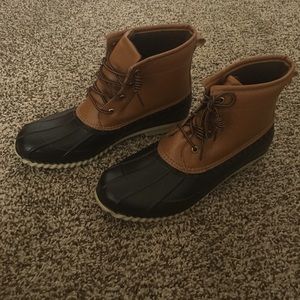 Brown duck boots.