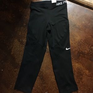 Nike Capris Leggings. Black with a little mesh.