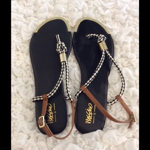 Black white sandals with gold accent