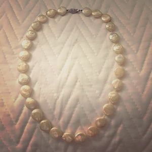 A strand of freshwater coin pearls.