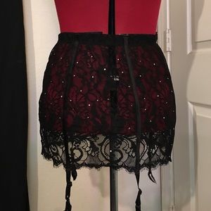 Lace garter skirt with rhinestones by Fredericks