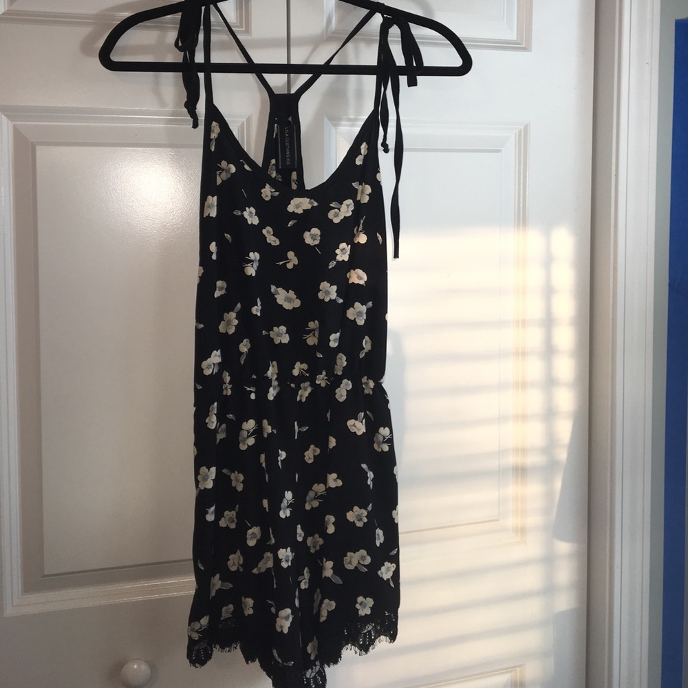 SOLD-Black floral Romper with Ivory on the flowers