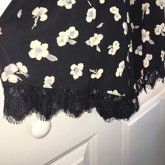 SOLD-Black floral Romper with Ivory on the flowers - Picture 2 of 3