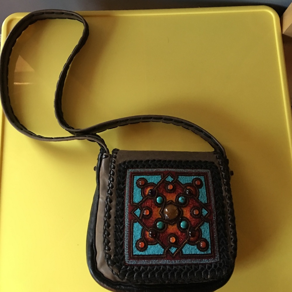 Handmade leather bag with semi-precious stones.