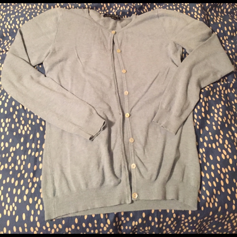 Light blue cardigan.