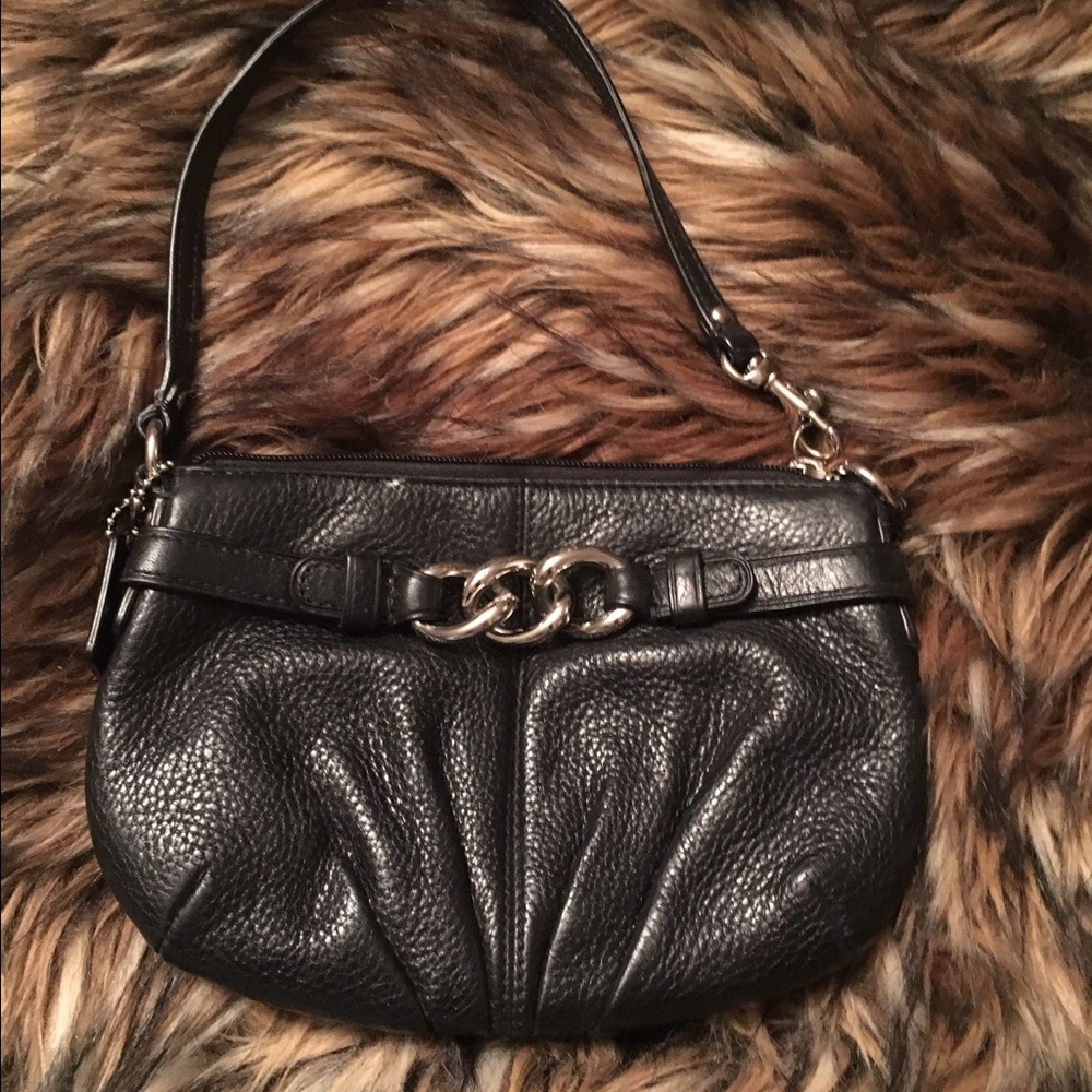 Coach black wristlet .