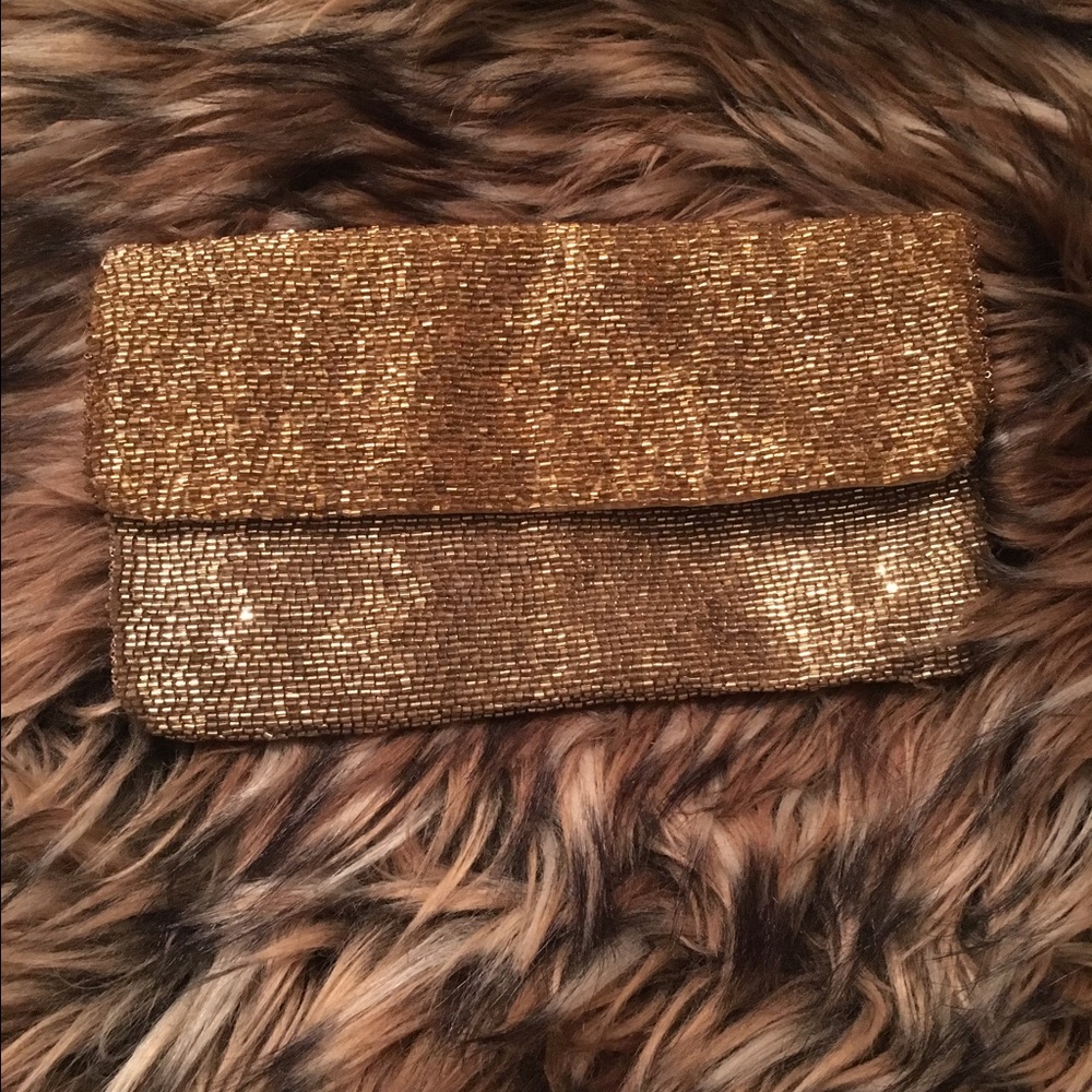 Loft gold evening clutch .