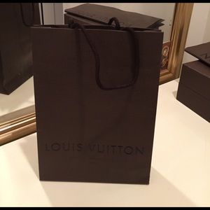 authentic Louis Vuitton shopping bag.