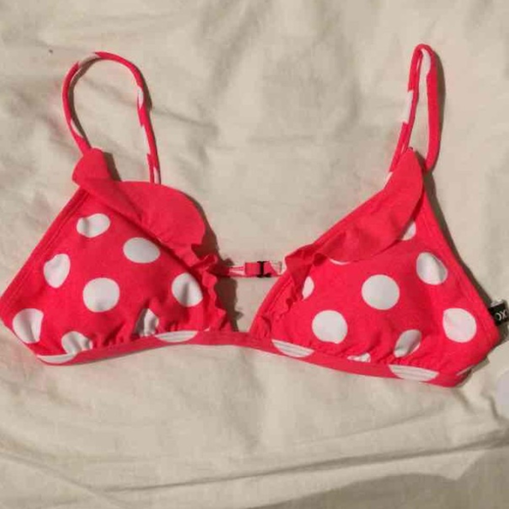 Pink and white polka dot swimsuit top