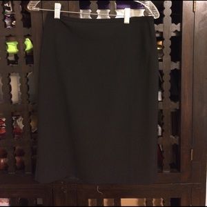 Black knee lenght skirt. New, never worn.