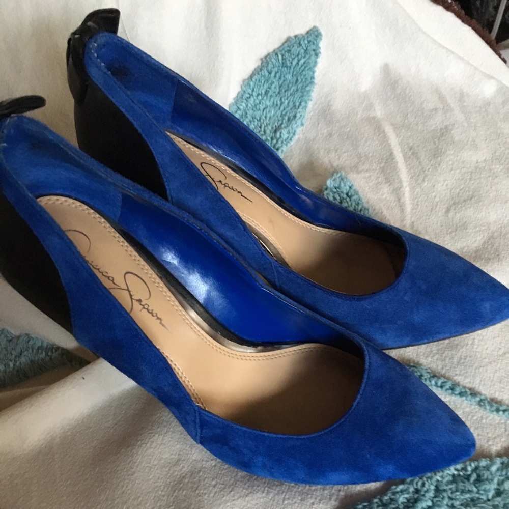 Two pairs of shoes.  Jessica Simpson & Fergie