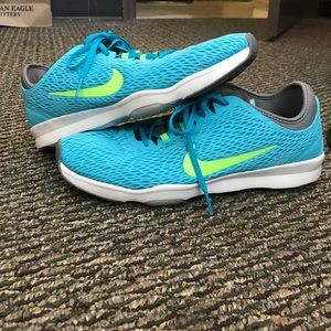 Green and Blue Nike training sneakers