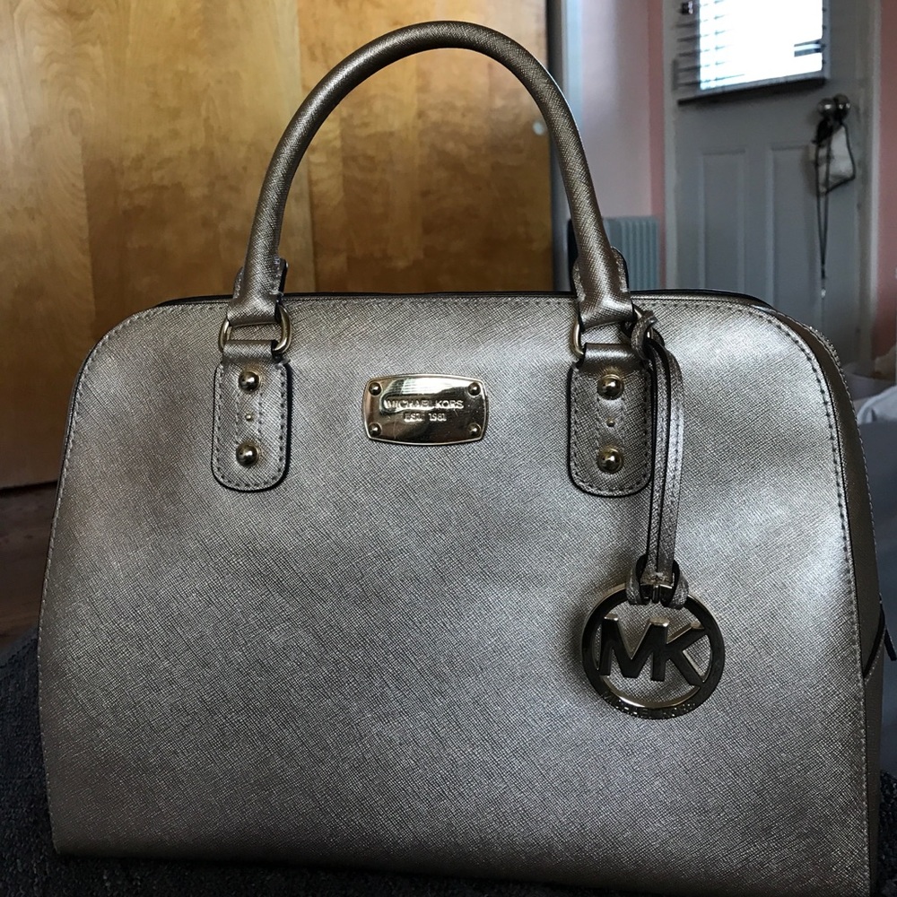 Gently used gold Michael Kors purse