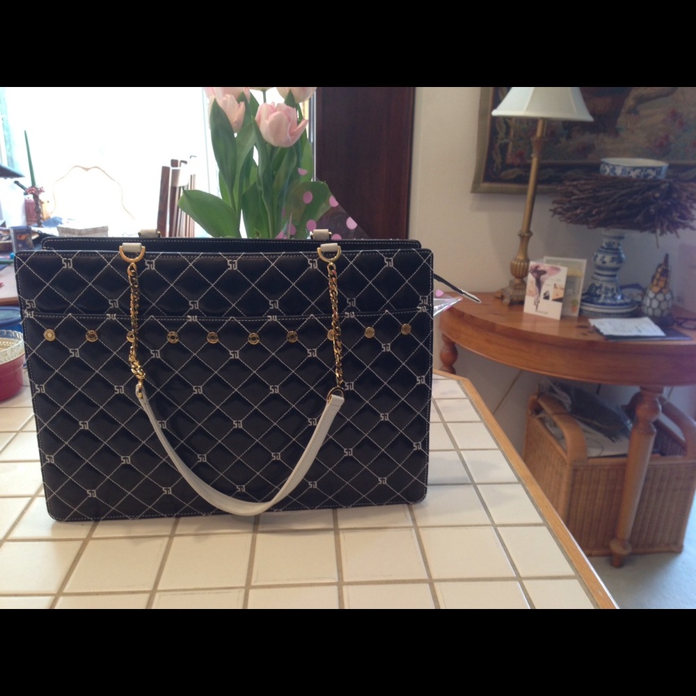 Beautiful St. John black/white leather.Never used.