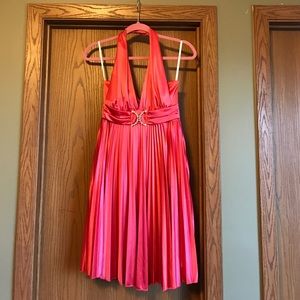 Shiny satin polyester coral cocktail dress.