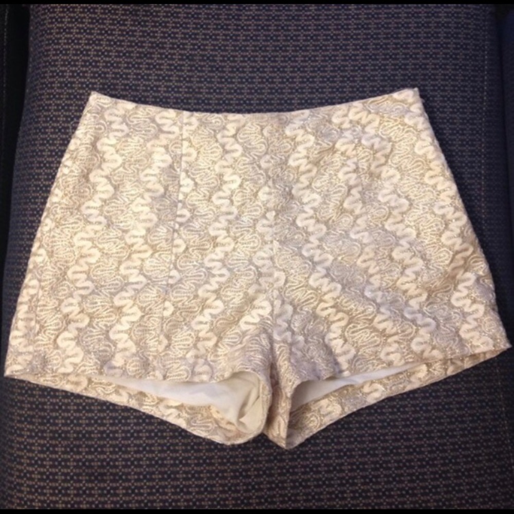 High waisted white and gold lace brocade shorts.