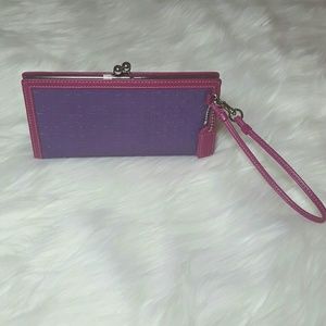 Coach embossed clutch with clasp and leather tag