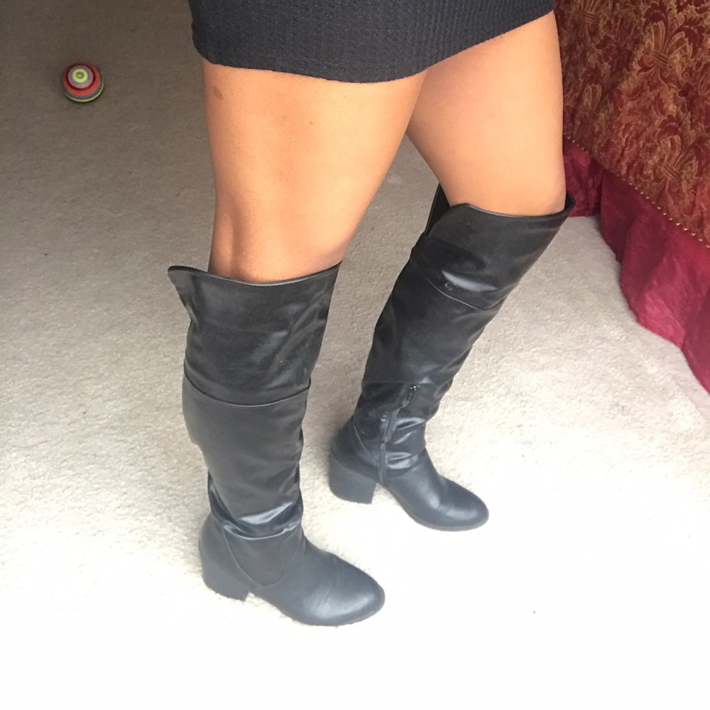 Black leather heeled knee high boots