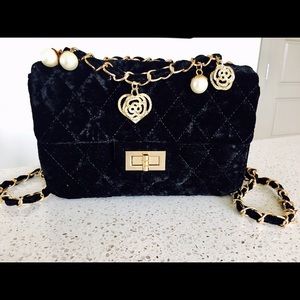 Unique velvet flap bag with charms