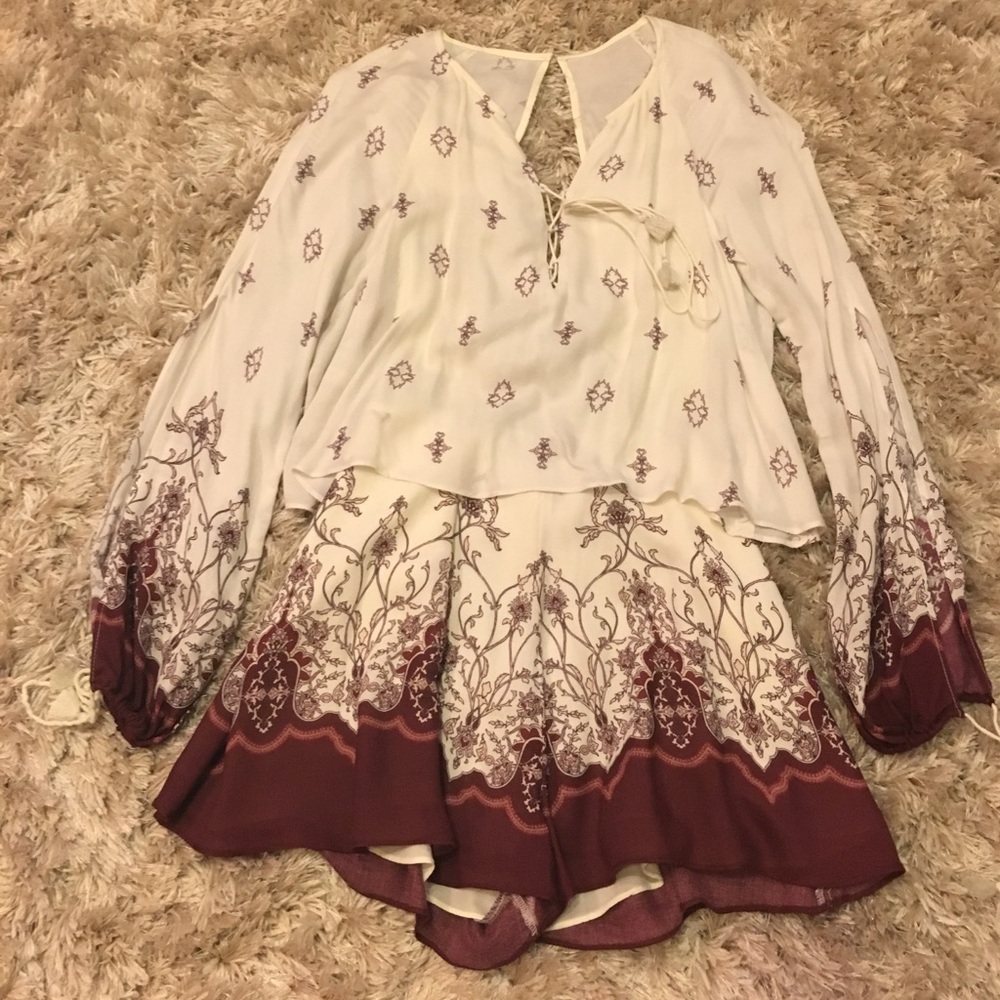 TJD romper in size XS with arm slits