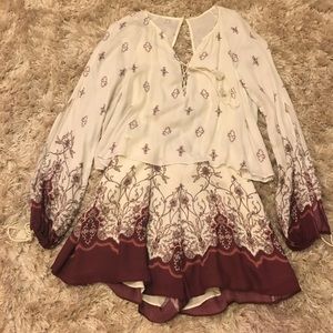 TJD romper in size XS with arm slits