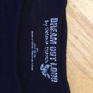 A three quarter sleeve crop top.