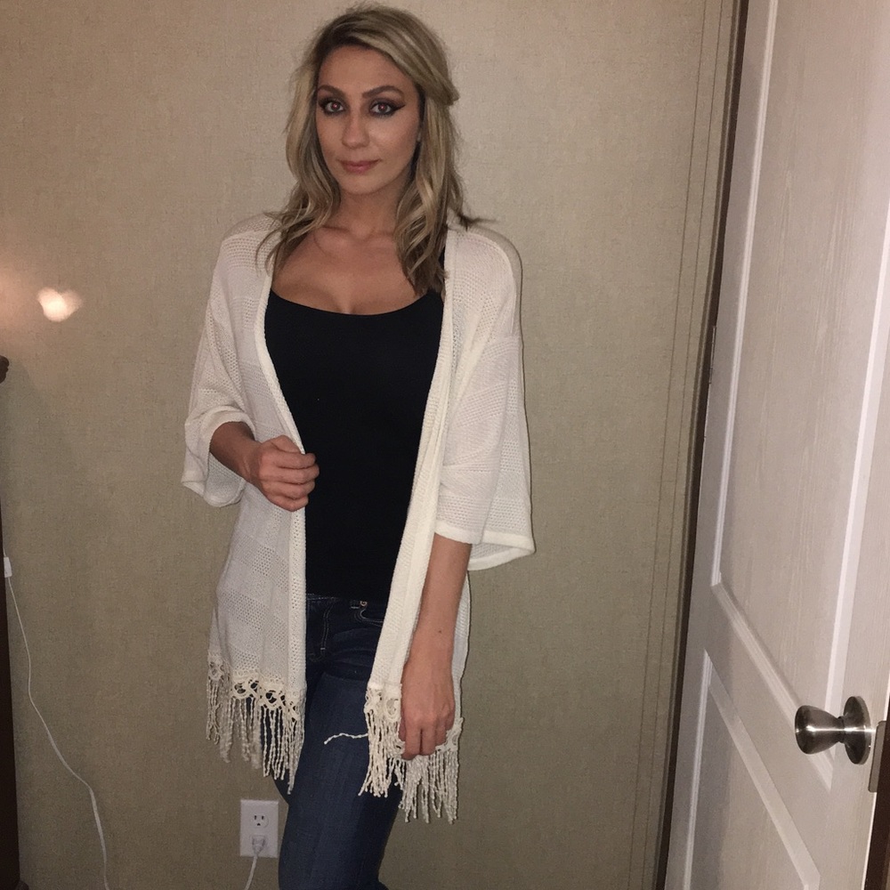 Super cute Cardigan with fringes.