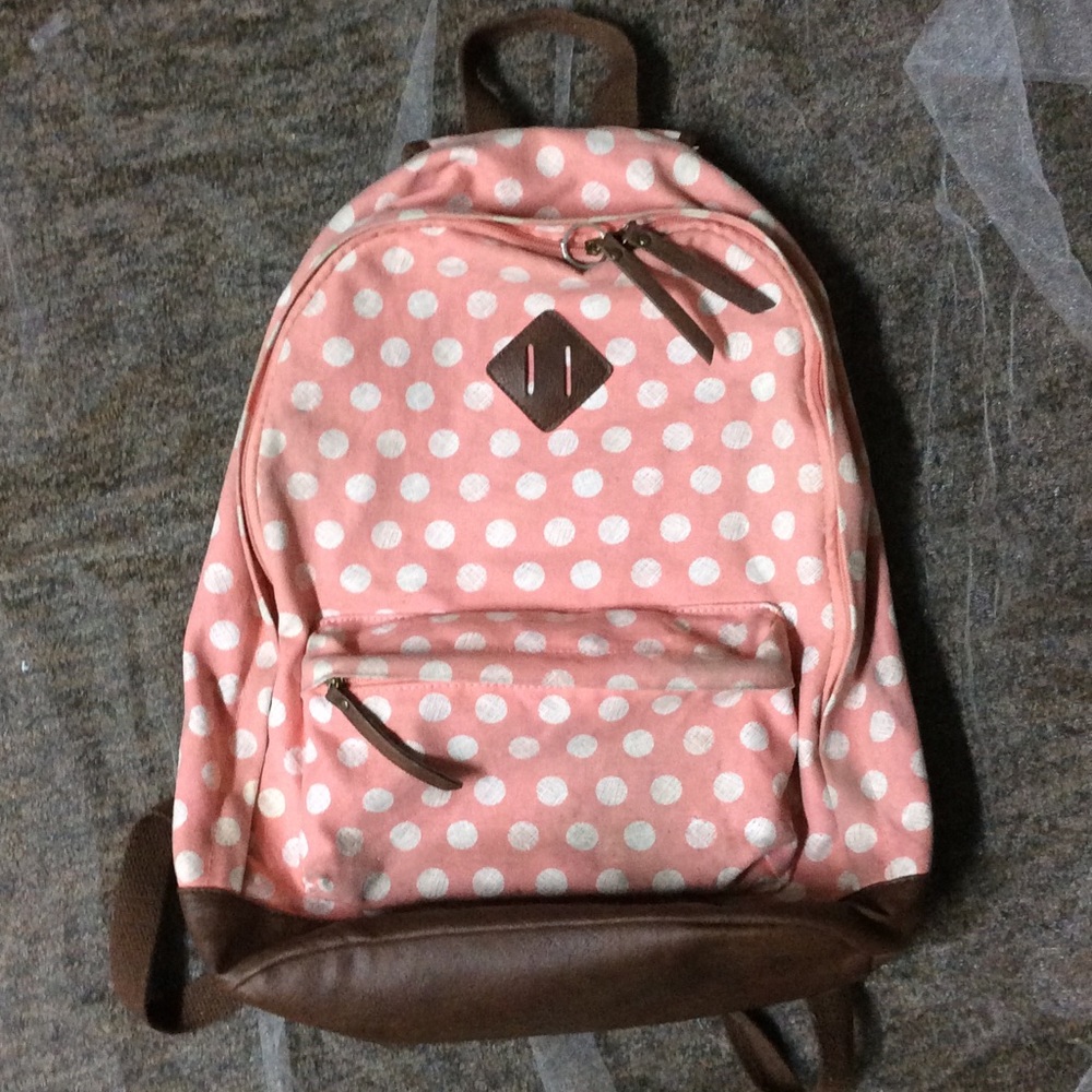 Pink and white polka dot backpack
