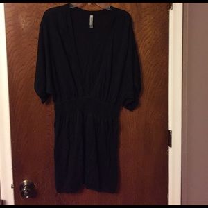 Swimsuit cover.  V neck in front, elastic waist.