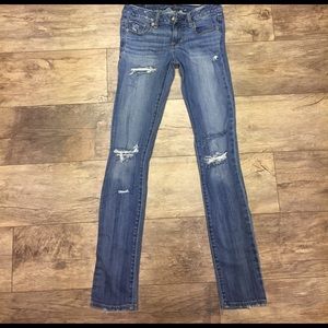 Medium wash distressed American Eagle skinny jeans