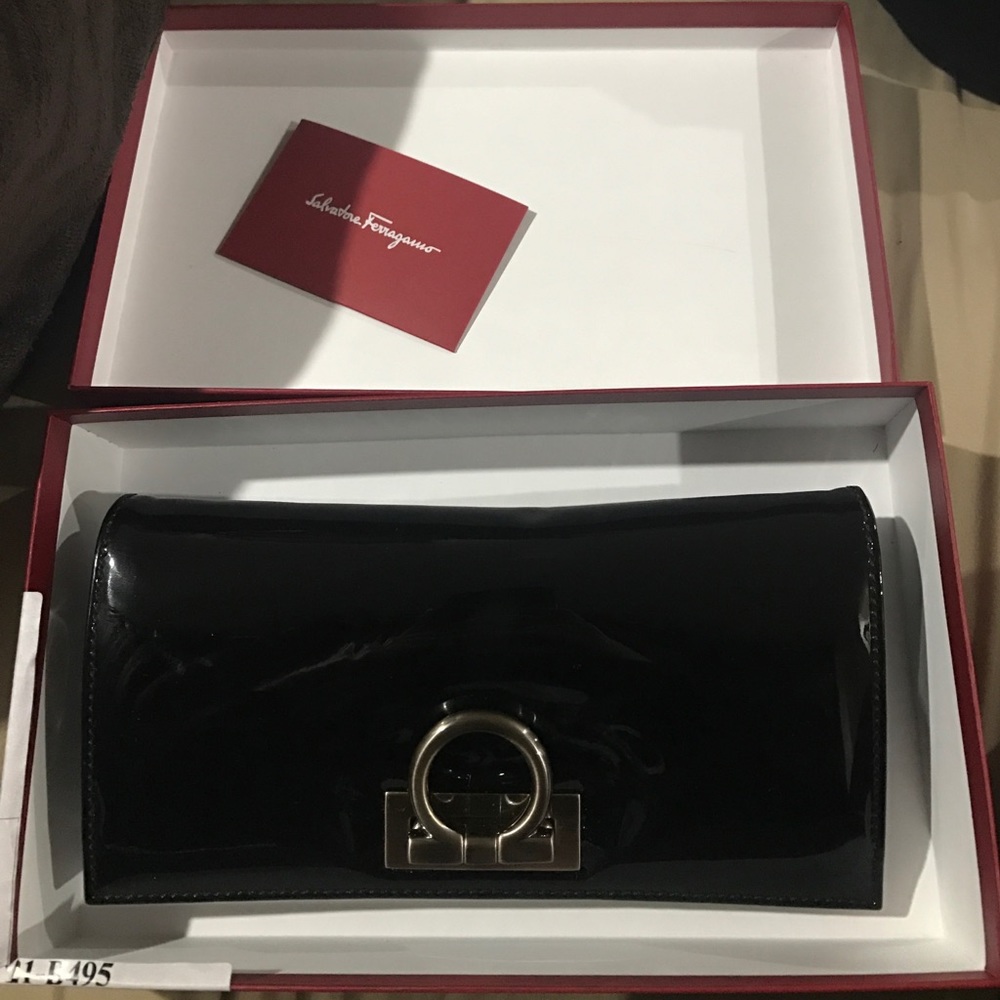 Ferrargamo clutch brand new