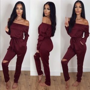 Dark red, off the shoulder, one piece jumper...