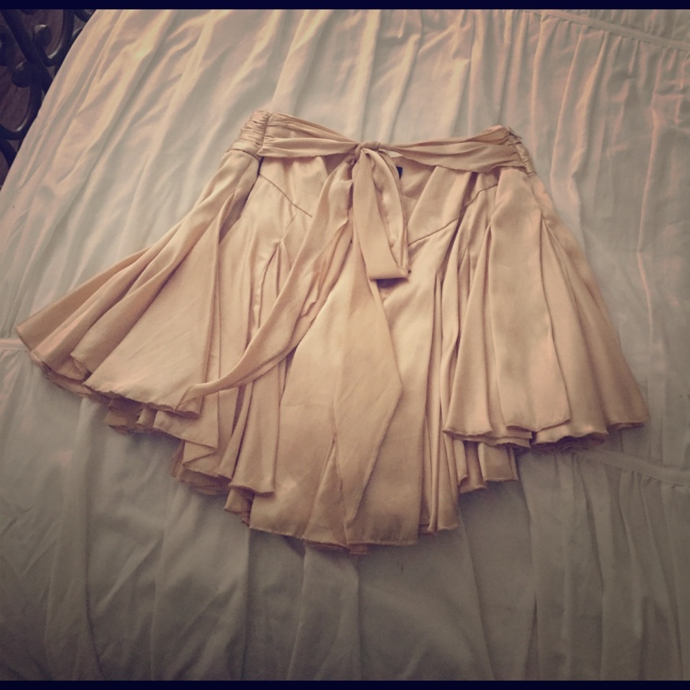 Golden-beige mini skirt, size SX. Gently used.