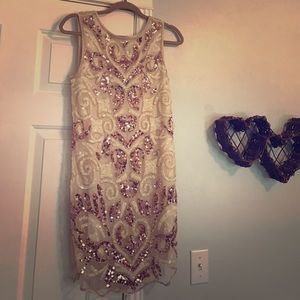 Low back, short sequined dress