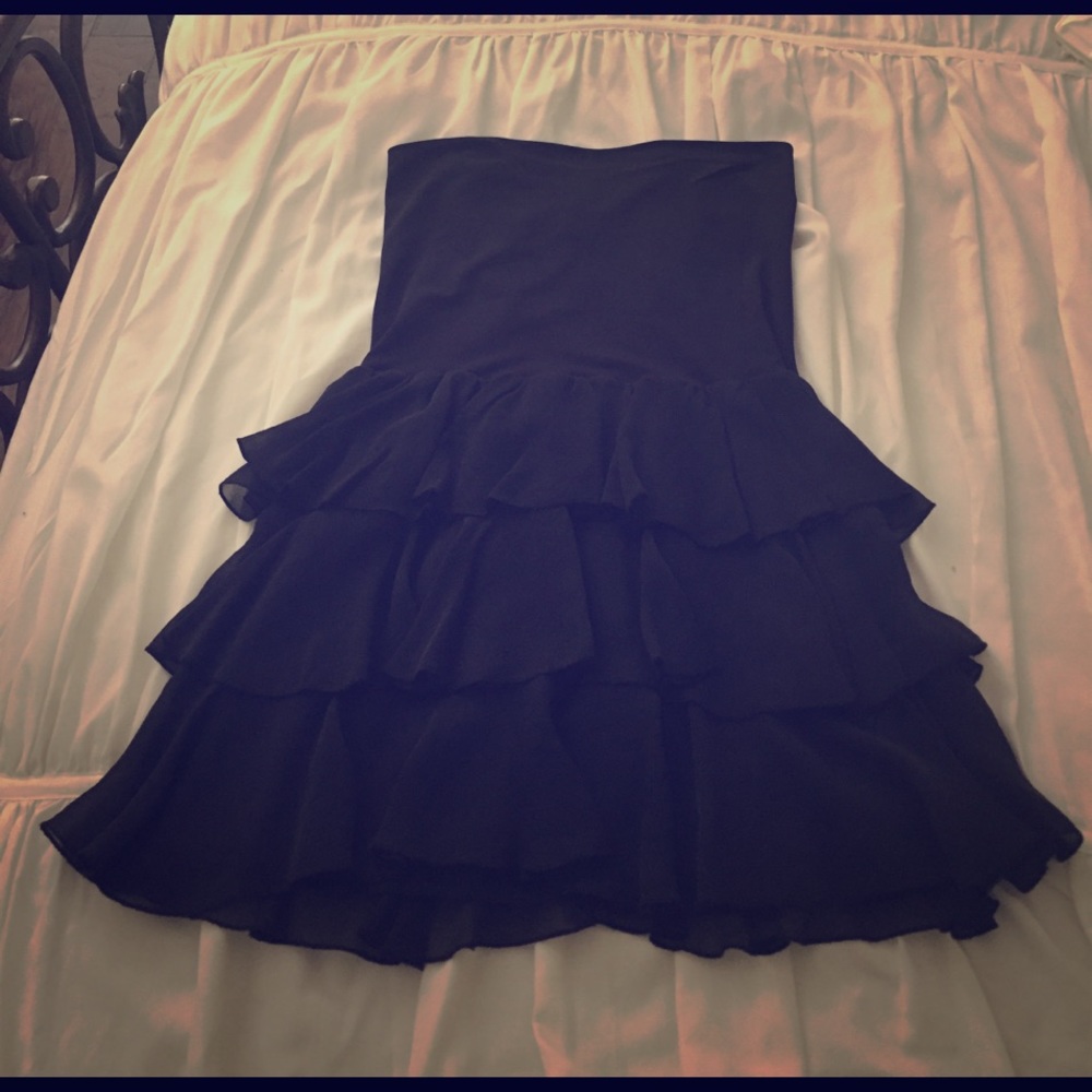 A black, high waisted skirt by Bebe, size S.