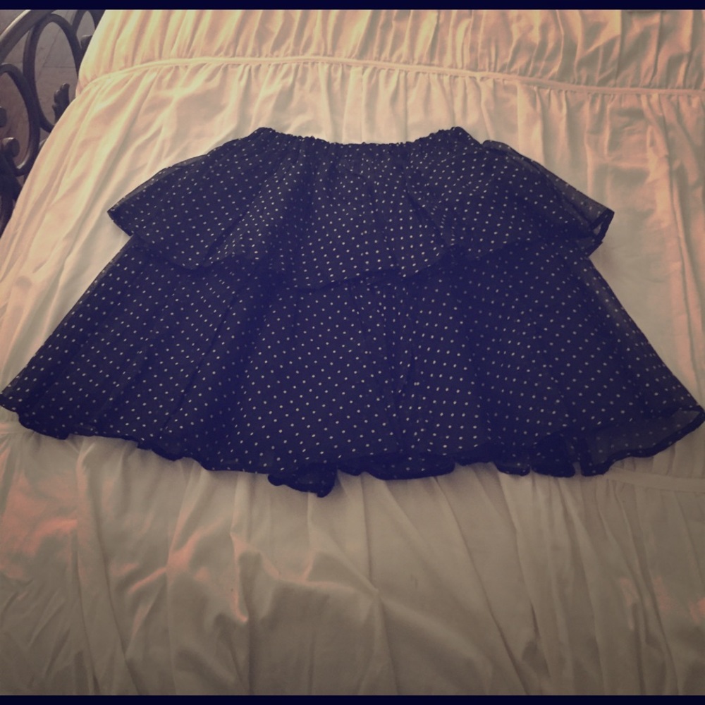 Layered polka dot skirt, knee length, waist high.