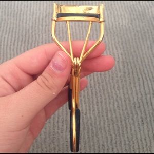 Gold and black eyelash curler
