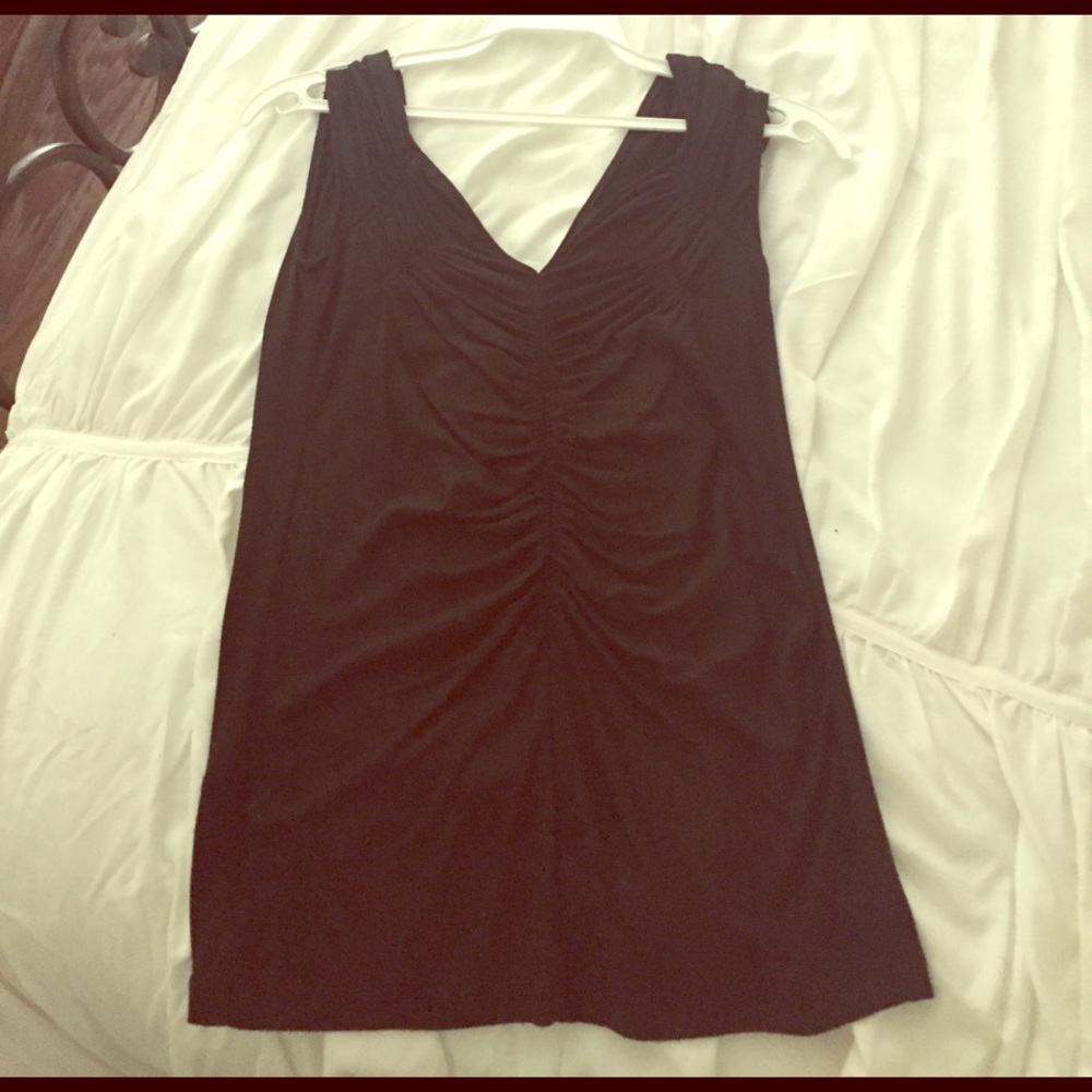 A BCBG sleeveless black top, size XS.