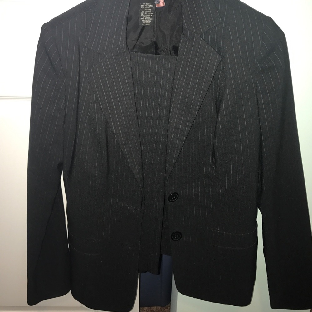 Rampage black pant suit with white and red stripe.