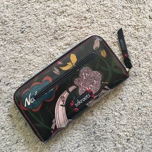 Illustrative Sakroots wallet / clutch