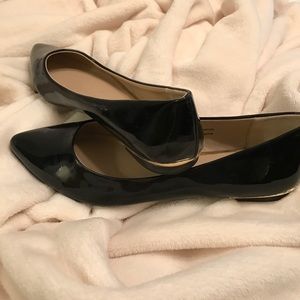 Black shiny flats
