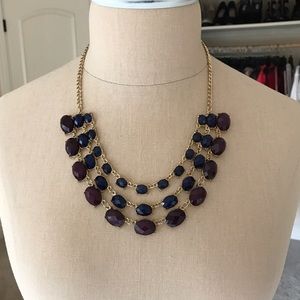 Gold necklace with blue and purple stones