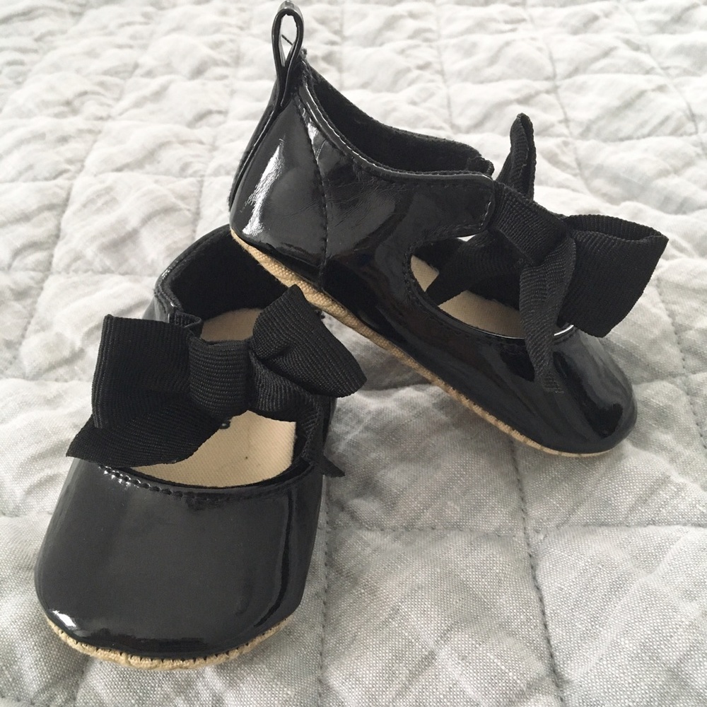 Black patent flats with black grosgrain bow